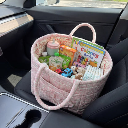 Quilty storage basket filled with everyday essentials in a car seat